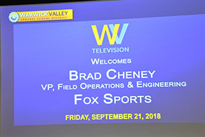 Screen with info about WVHS alum speaker, Brad Cheney