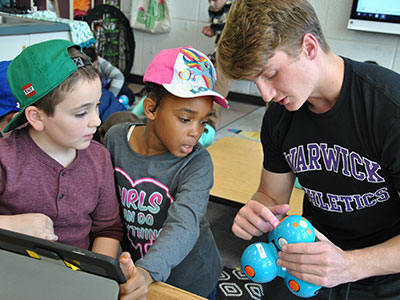 WVHS and PA students work together on a robotics project.