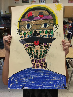 An  art student holds a self portrait in front of his face