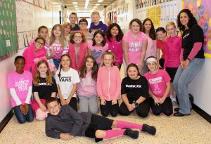 middle school students dressed in pink