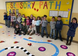 students in the sensory path hallway 