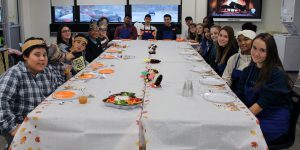 Students having a thanksgiving lunch at the middle school