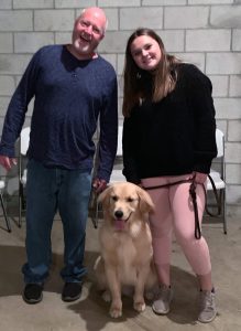 Jim Epperly and Maggie Schloika with a dog